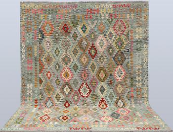 A Kilim rug, approx. 298 x 248 cm.
