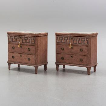 A pair of Gustavian style painted chest of drawers.