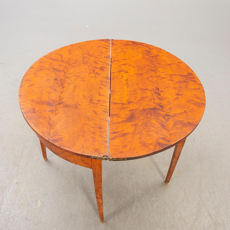 A birch late 19th century game table.