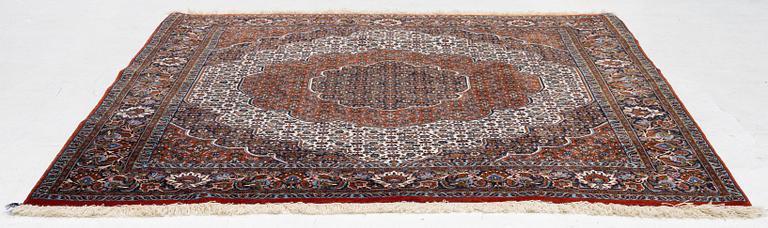 An Oriental rug, approx. 213 x 201 cm.