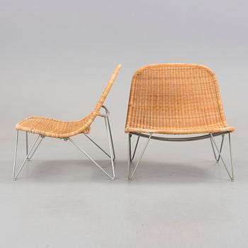 a pair of 21h Century lounge chairs designed by James Irvine, by IKEA.