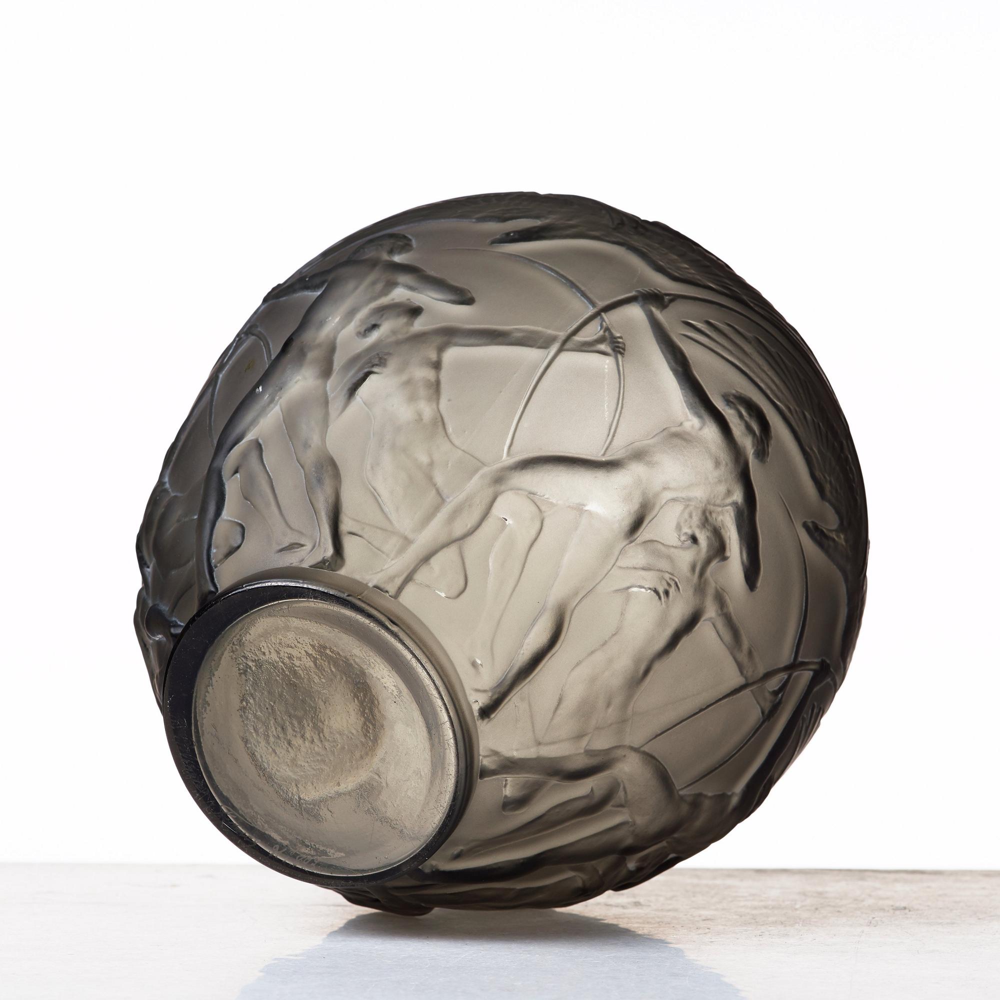 René Lalique, an "Archers" moulded smoke-coloured glass vase, model nr 893, France, post 1921.