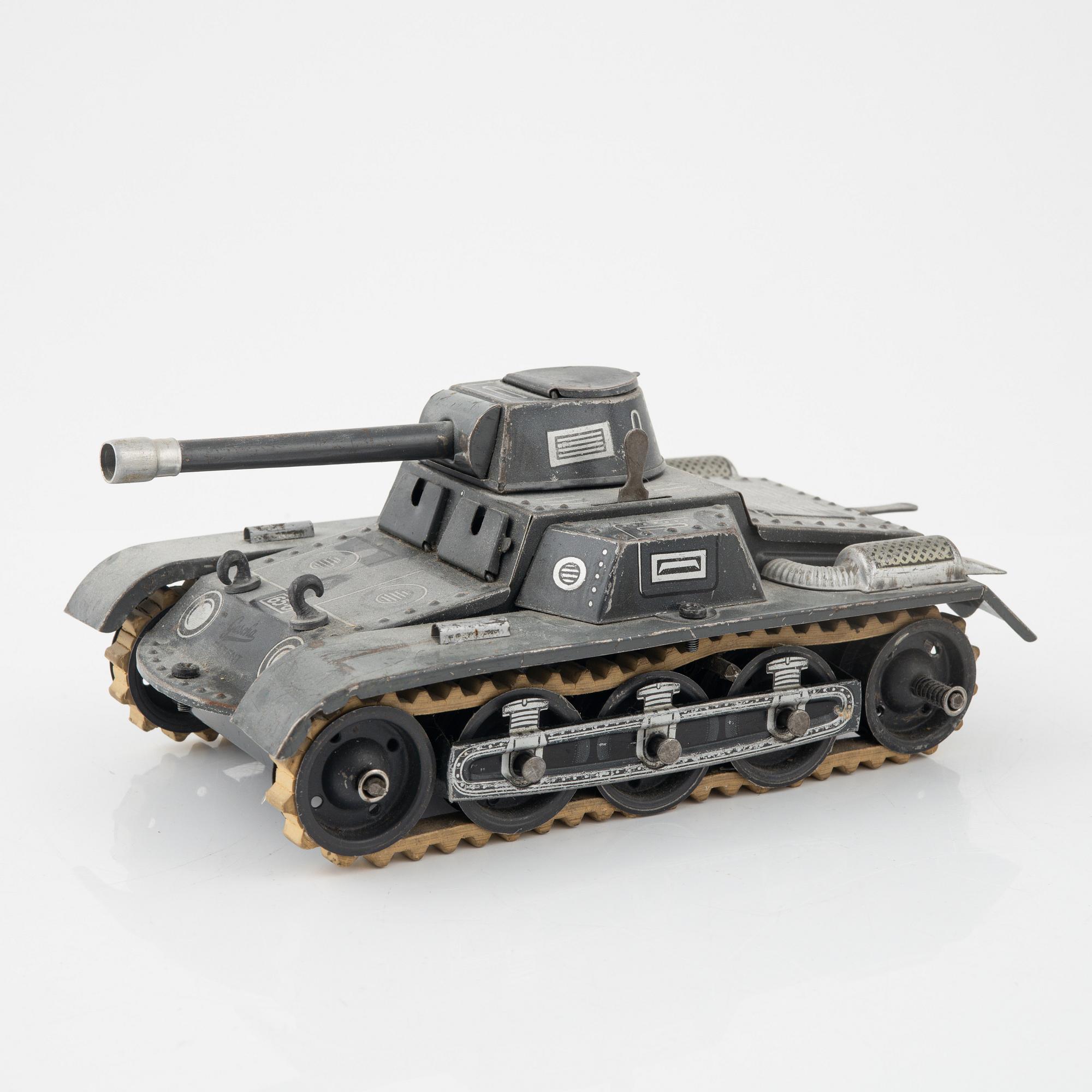 Three tin toys including a Gescha tank, Germany, mid 20th century.