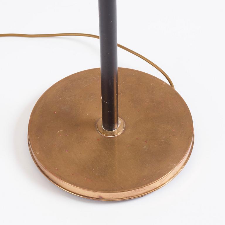 Josef Frank, a brass and black lacquered floor lamp model "2431", Firma Svenskt Tenn, Sweden.