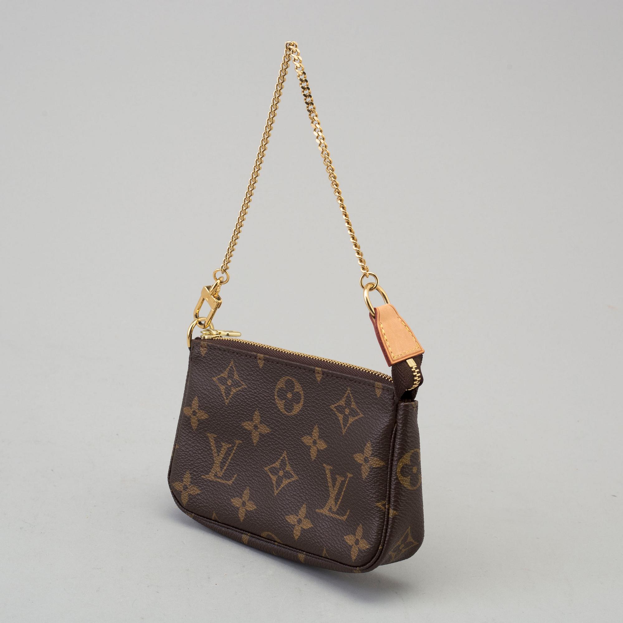 a LOUIS VUITTON small bag/pouch.