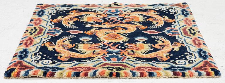 A Chinese small square rug, semi-antique, 65 x 68 cm.