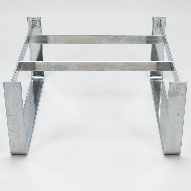 A chromed steel and polished granite coffee table, latter half of the 20th century.