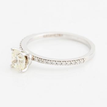 Ring with cushion-cut yellow diamond.
