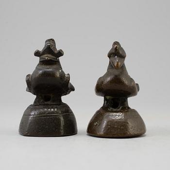 Two opium weights, Burma, circa 1900.