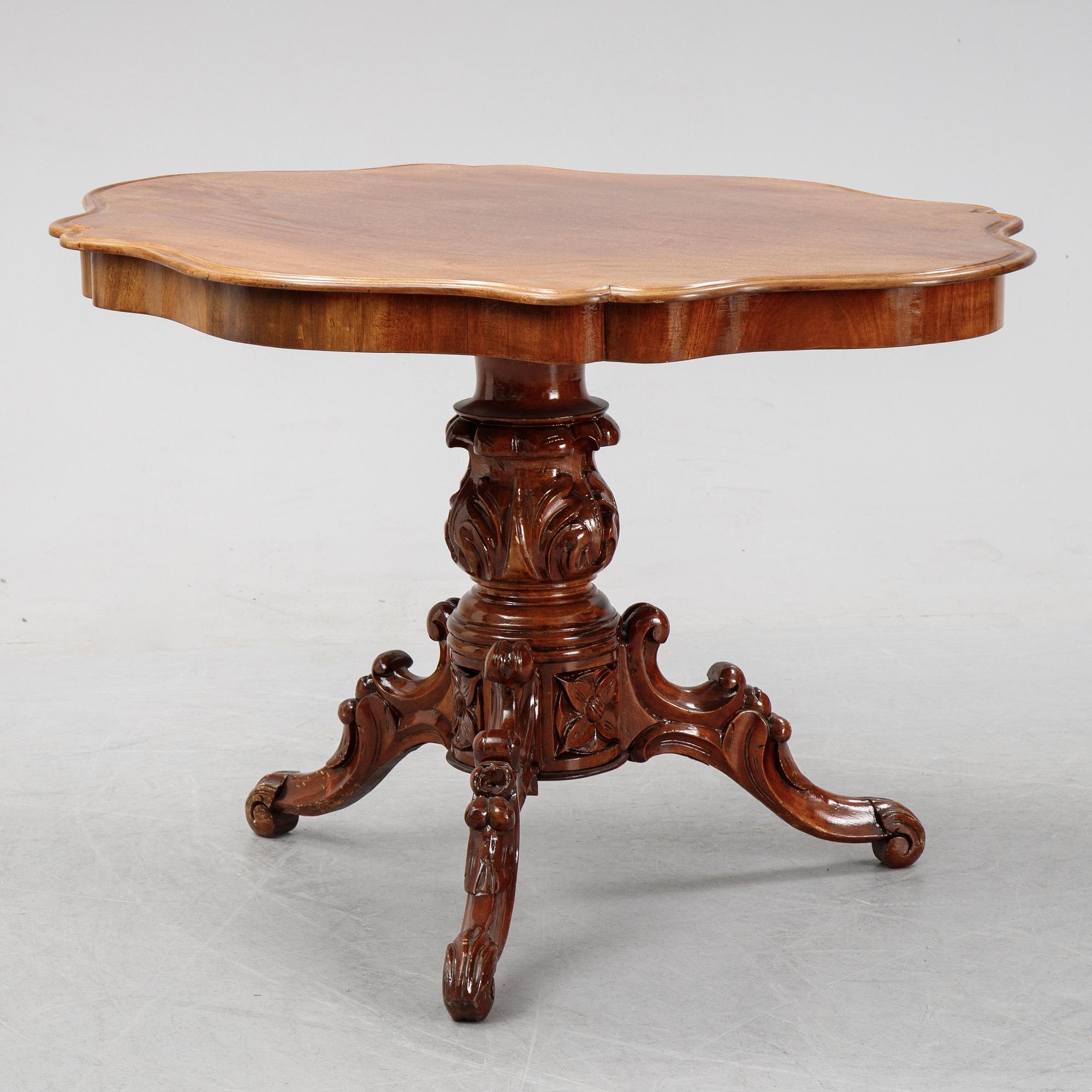 A rococo style sofa, four chairs and a table, second half of the 19th Century.