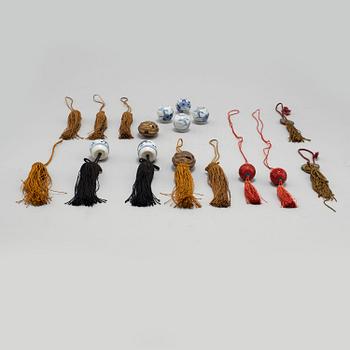 Eight (6+2) tassles, porcelain and bronze, Japan, 20th century.
