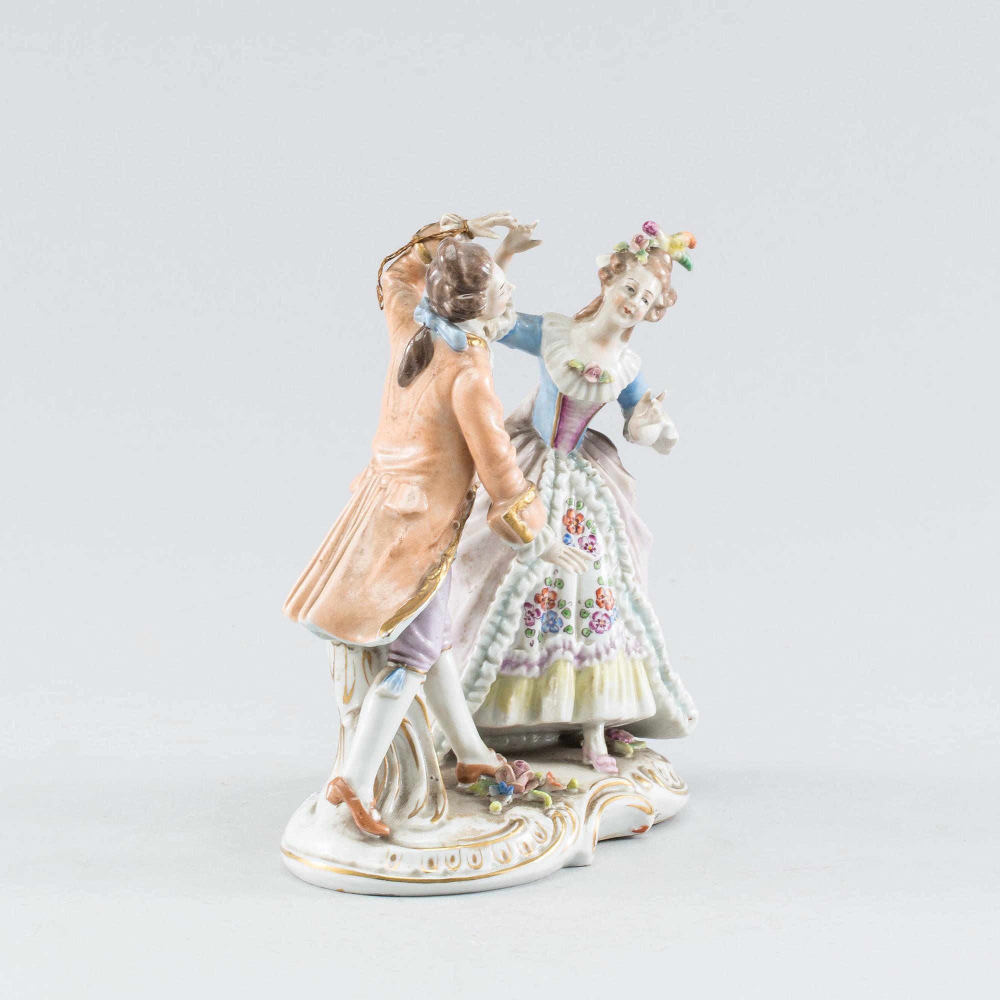 A Rococo style porcelain figure group. First half of the 20th Century.
