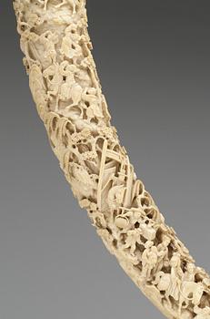 A finely carved ivory tusk, Qing dynasty, 19th Century.