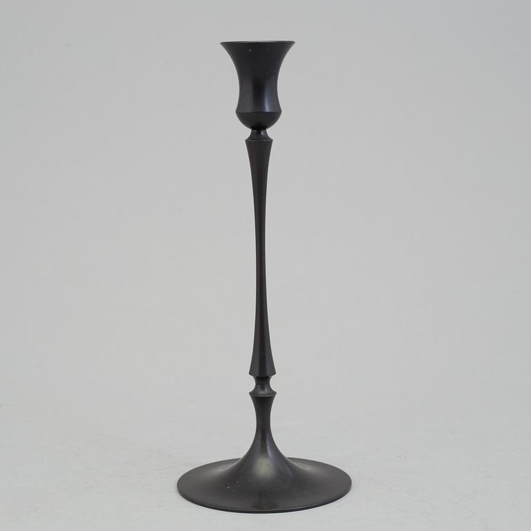 A bronze "Egg and dart candlestick" by E.R. Butler, Ted Muehling.