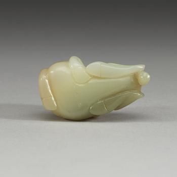 A Chinese nephrite figure of a reclining horse.