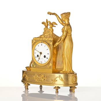 A French Empire figural mantel clock, early 19th century.