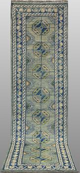 An Oriental runner, c. 296 x 77 cm.