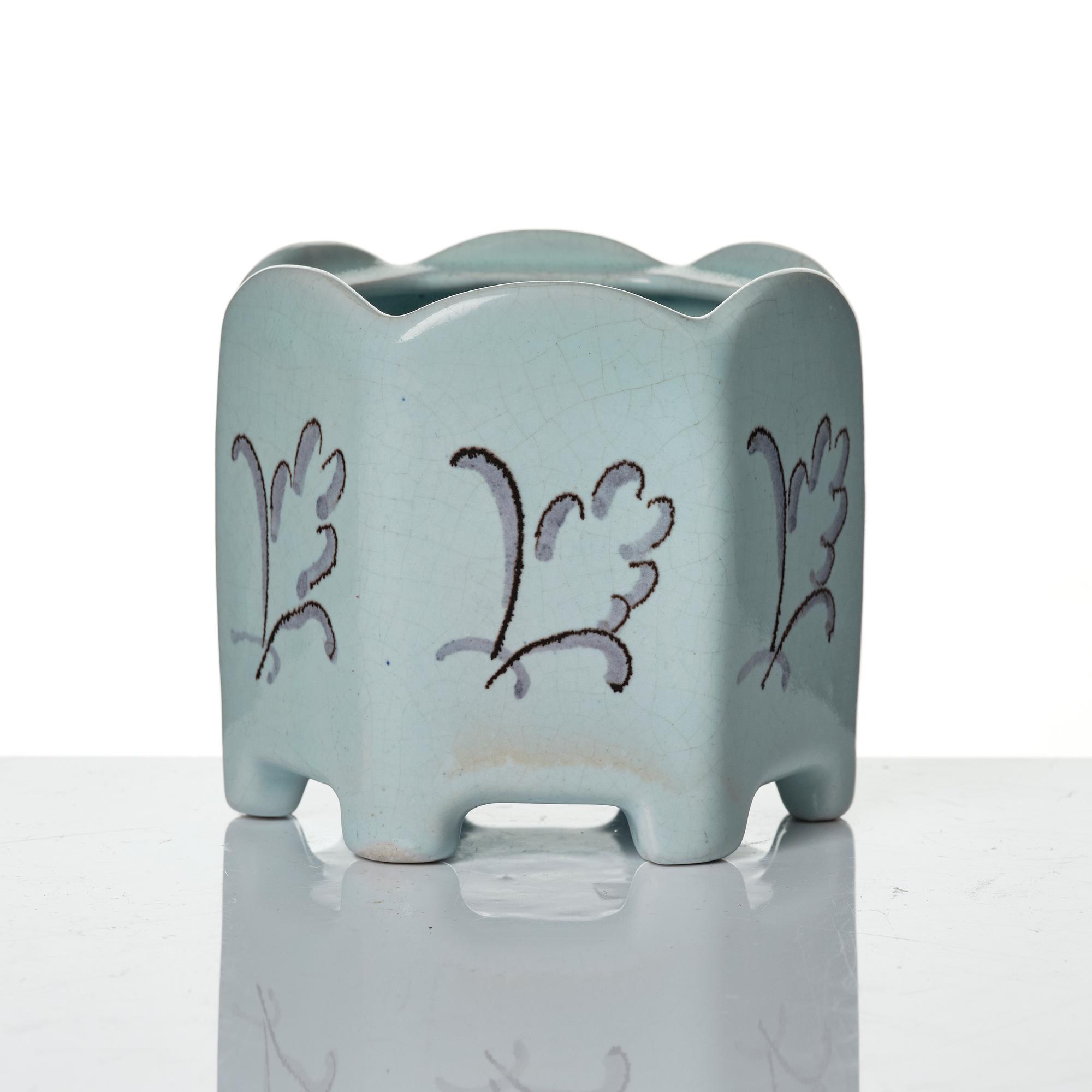 Wilhelm Kåge, eleven pieces of faience including jars, inkwells and a tulip vase, Gustavsberg, Sweden, 1919-1920.