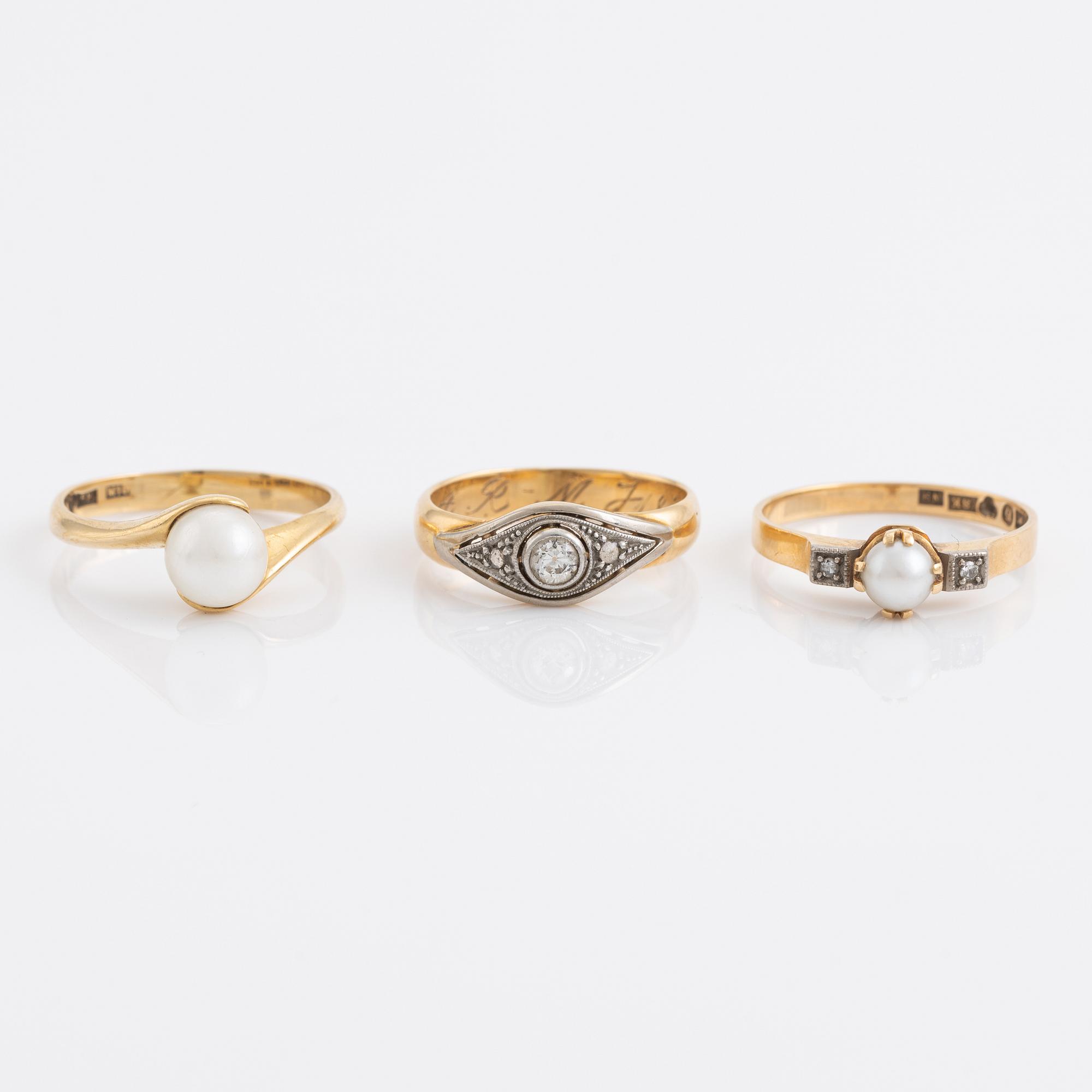 Three pearl and diamond rings.