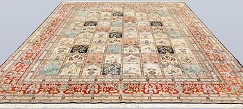 An oriental silk carpet, approx. 376 x 274 cm.