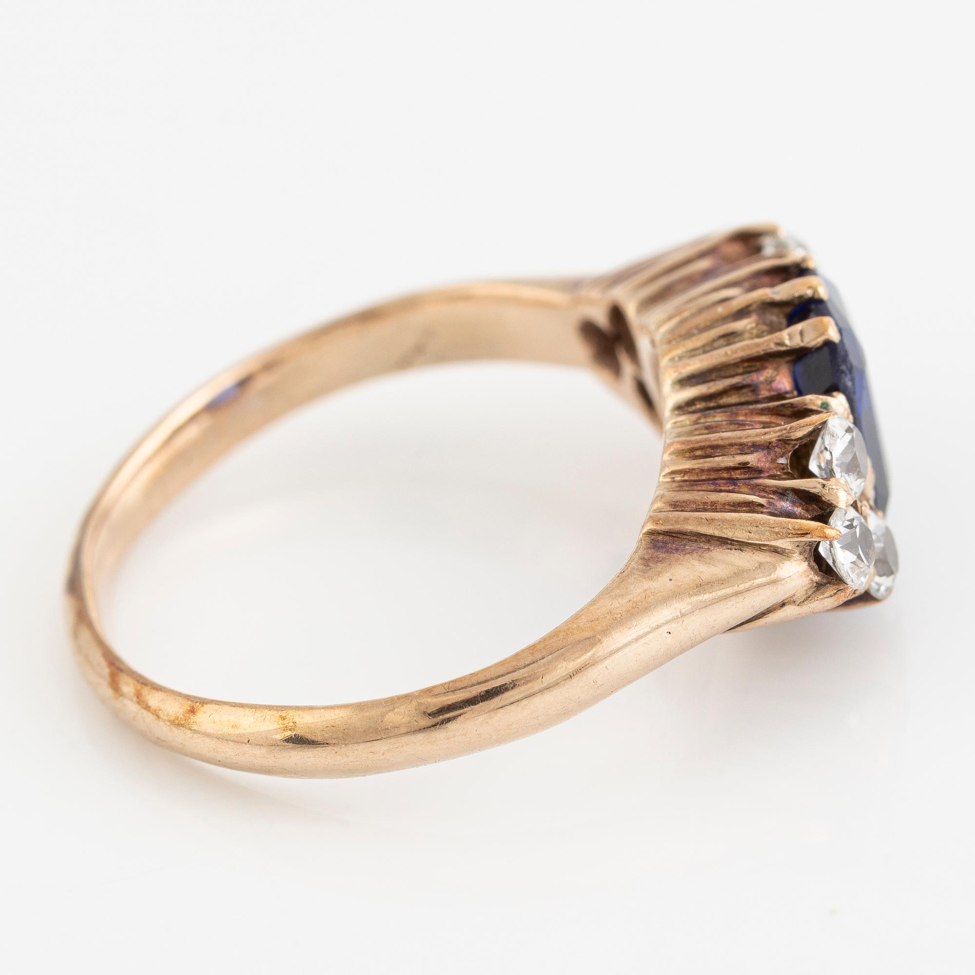 Ring, 14K gold with blue sapphire and white stones.