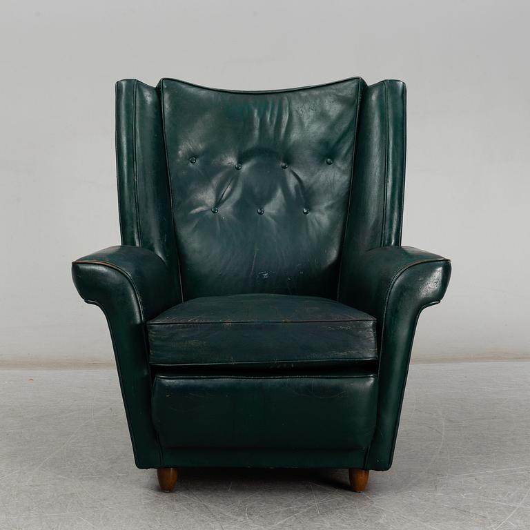 A Collins & Hayes armchair, mid 20th century. Signed with label.