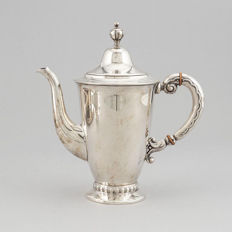 A silver coffee pot, creamer and sugar bowl, CG Hallberg Stockholm 1932-39.