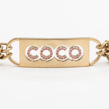 Chanel, A gold coloured metal chain belt with pink stones. Marked "CHANEL 02 CC P MADE IN ITALY".