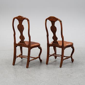 A set of nine English stained beech wood chairs, first half of the 18th Century.