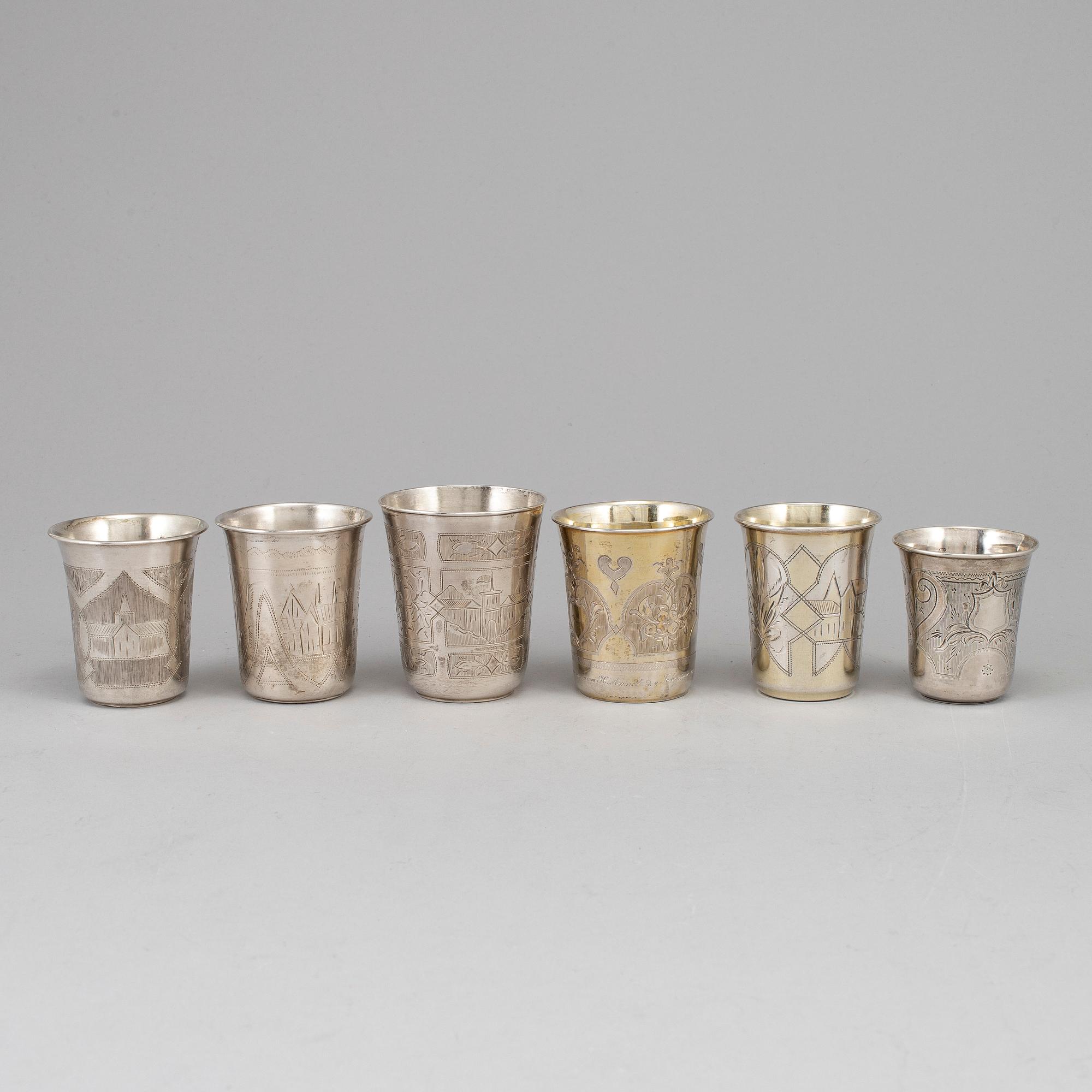 A set of six Russian 19th century parcel-gilt silver vodka cups.