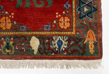 A Nepalese rug, c. 157 x 91cm.