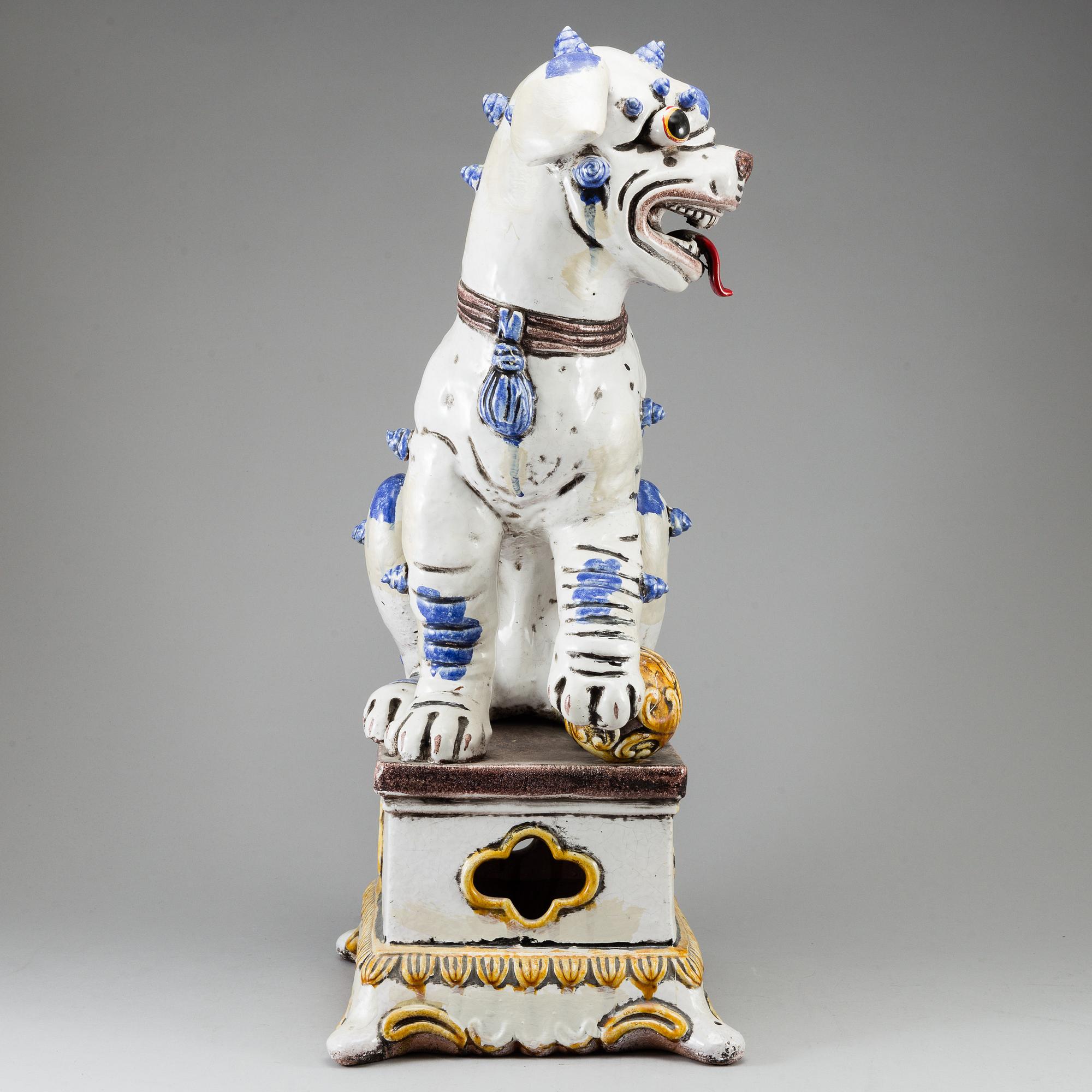 A large Chinese ceramic tile sculpture of a buddhist lion, 20th century.