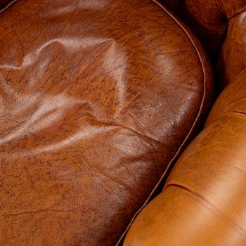 A pair of leather armchairs, second half of the 20th century.