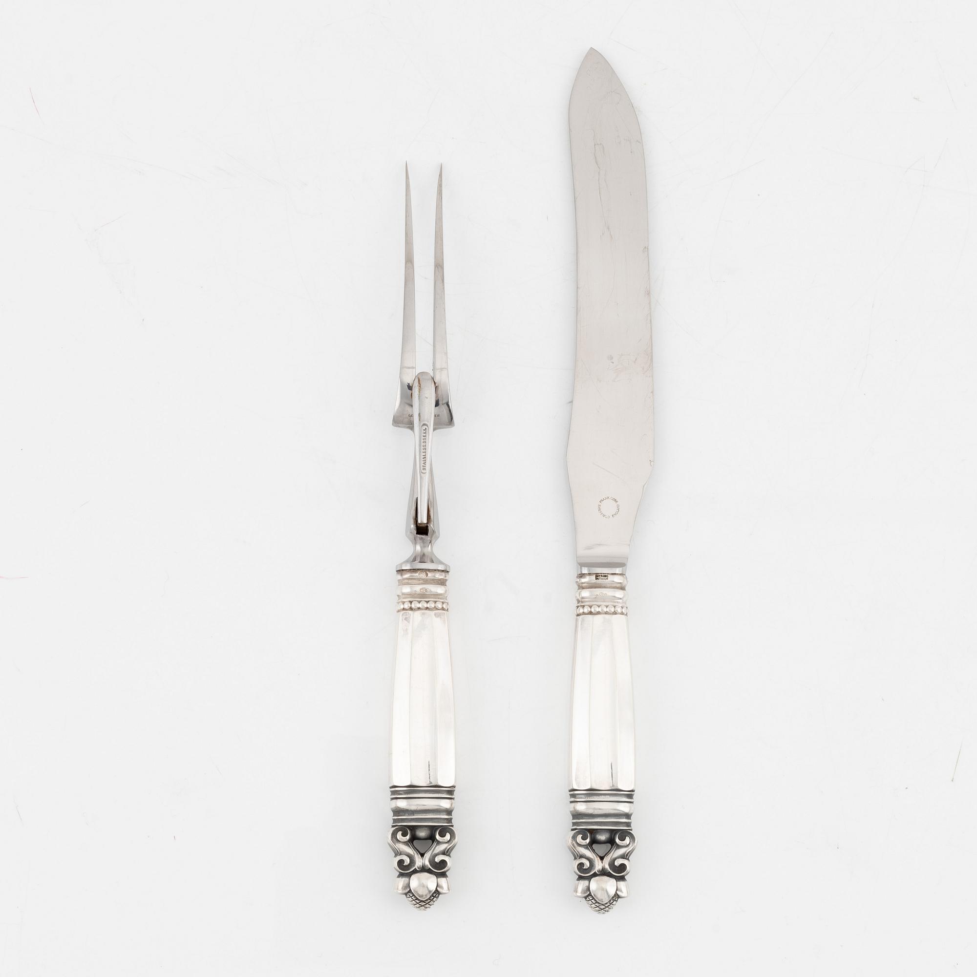 Johan Rohde, A sterling silver carving knife and fork set, 'Konge/Acorn', Georg Jensen, Denmark.