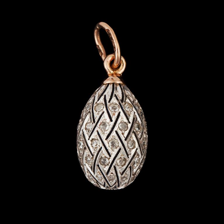 A pendant in the shape of an egg, surrounded by diamonds circa 0.30 ct.