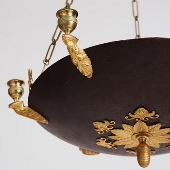 A Swedish Empire ormolu and tole six-branch chandelier, Stockholm, early 19th century.