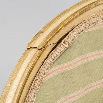 A matched pair of Gustavian style armchairs. One from around the year 1800 and one from around the year 1900.