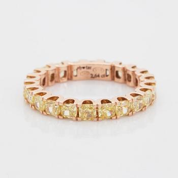 Cushion-cut yellow diamond eternity ring.