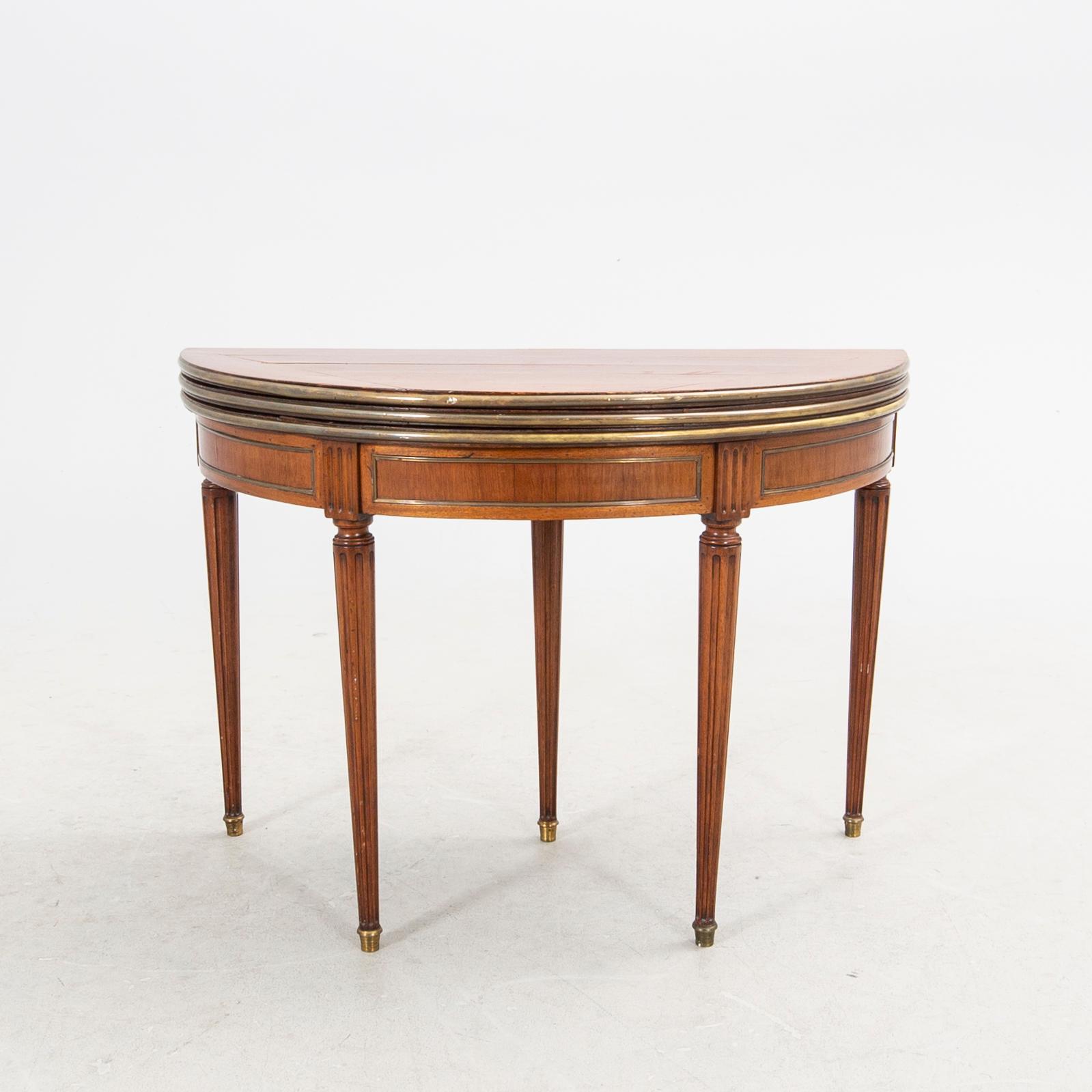 An erarly 1800s mahogany game table.