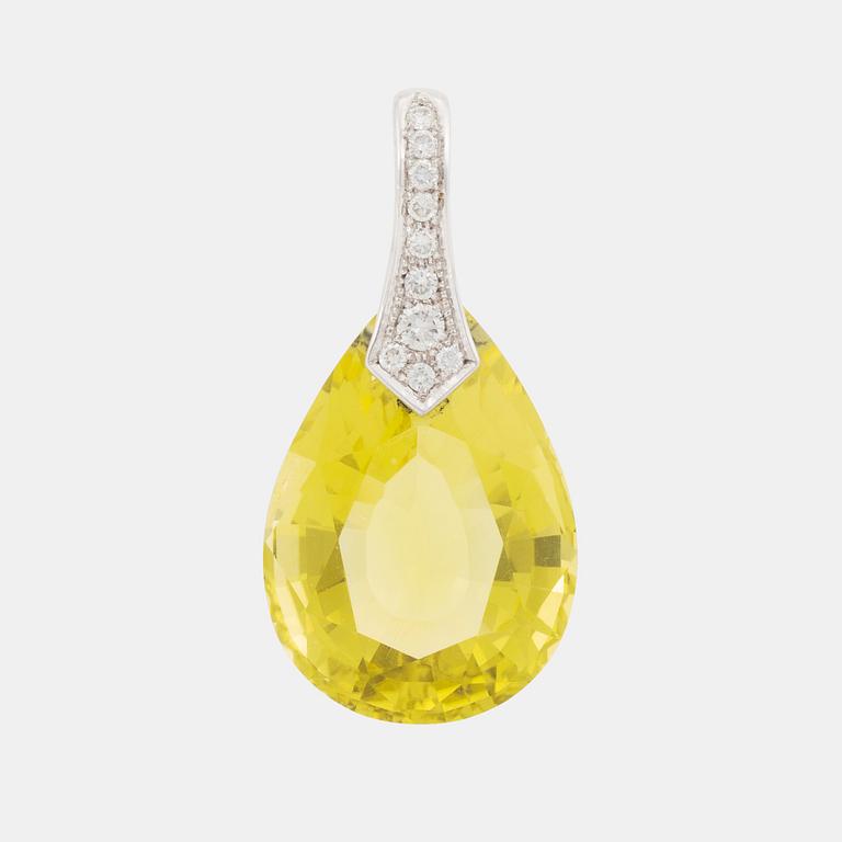 A Tina Karlsson 18K white gold pendant with a faceted helidor.