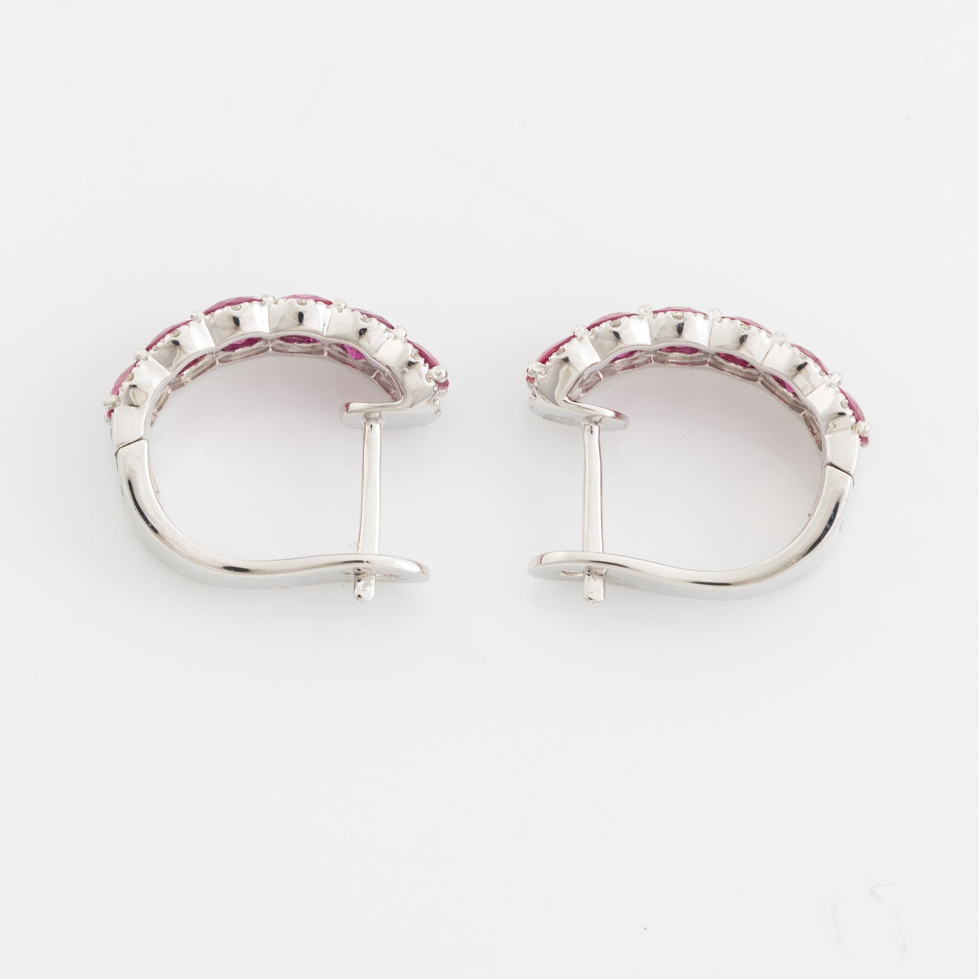 Earrings with rubies and brilliant-cut diamonds.