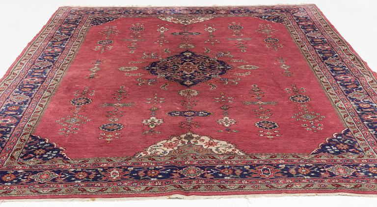 An oriental/eastern European carpet, c. 355 x 275 cm.