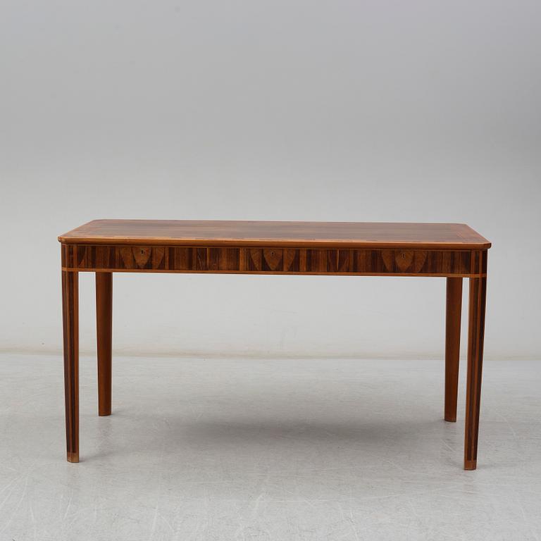 A desk by Carl Malmsten, dated 1979.