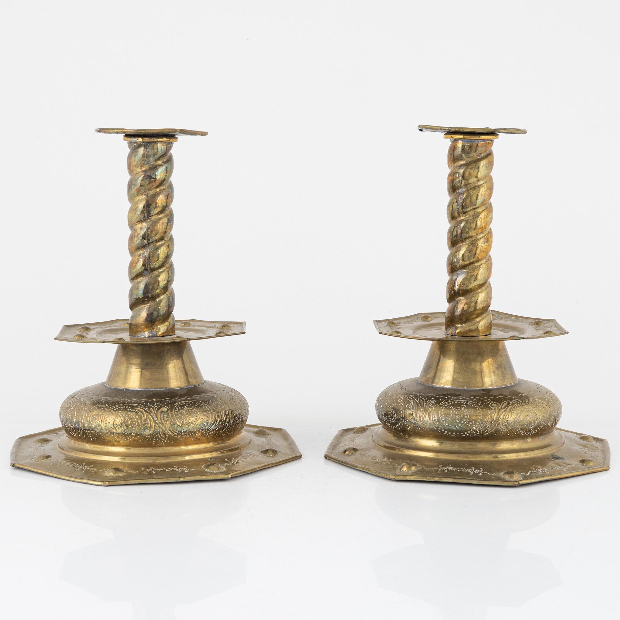 A pair of brass candlesticks, Baroque style, circa 1900.