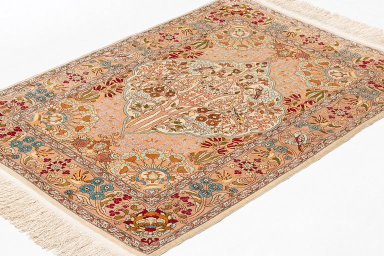 A rug, Old, silk Hereke, ca 128 x 90 cm.