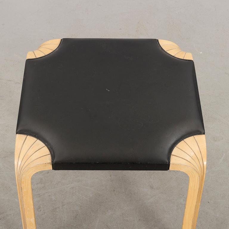 AN ALVAR AALTO "X602" STOOL by Artek.