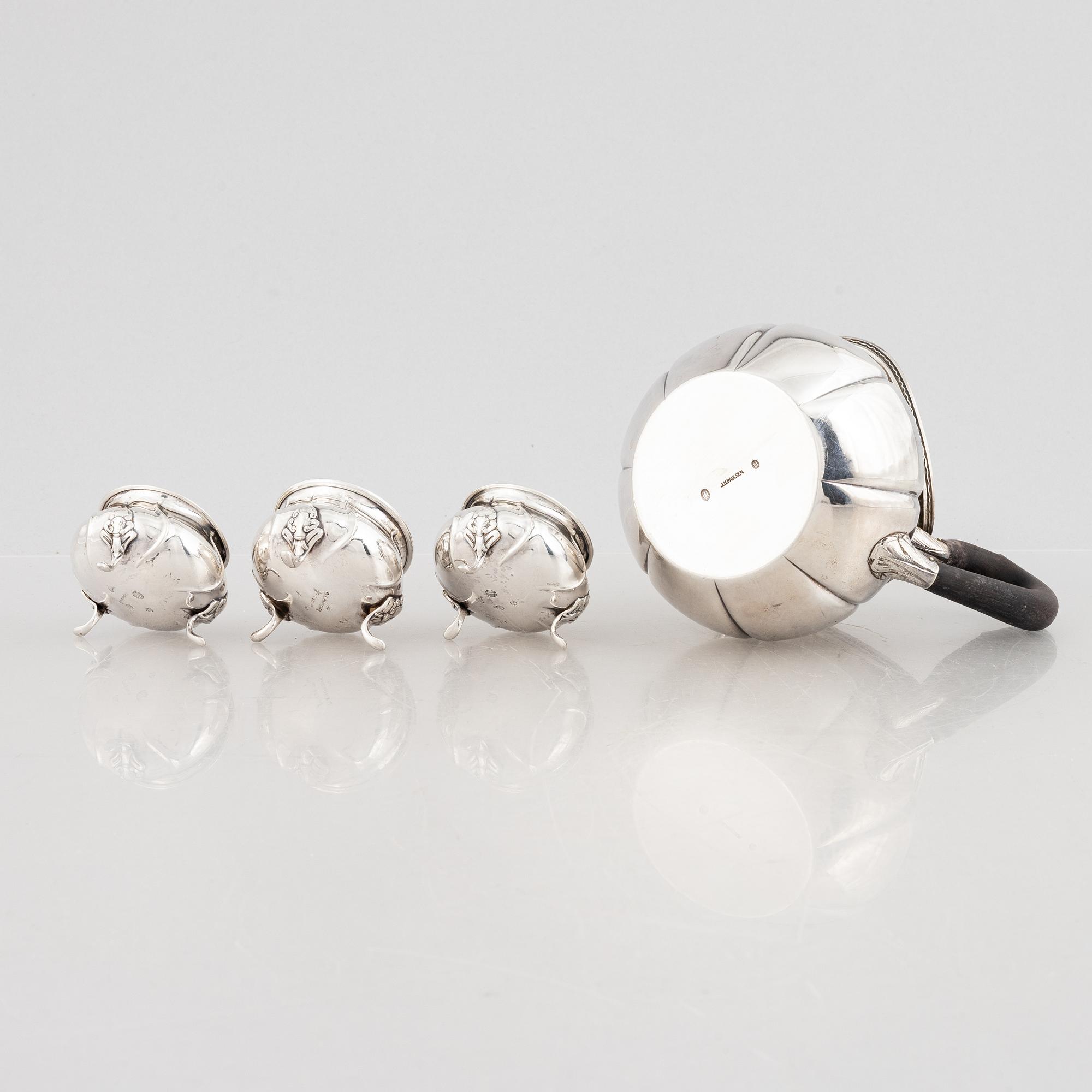 A Danish silver jug and three salt cellars, first half of the 10th Century.