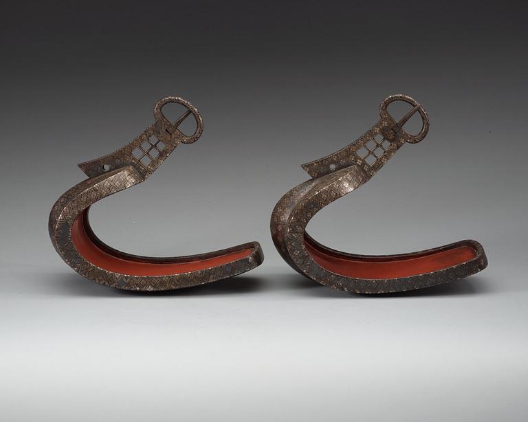 A pair of Japanese silvered bronze stirrups, Meiji (1868-1912).