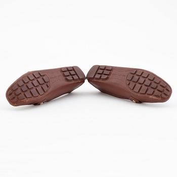 LOUIS VUITTON, a pair of brown leather loafers.