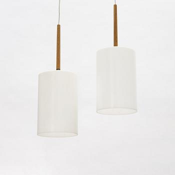 Uno & Östen Kristiansson, a pair of acrylic and oak ceiling lights, Lucus, Vittsjö.